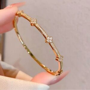 Cartier Gold Floral Link Diamond Accent Bangle Bracelet